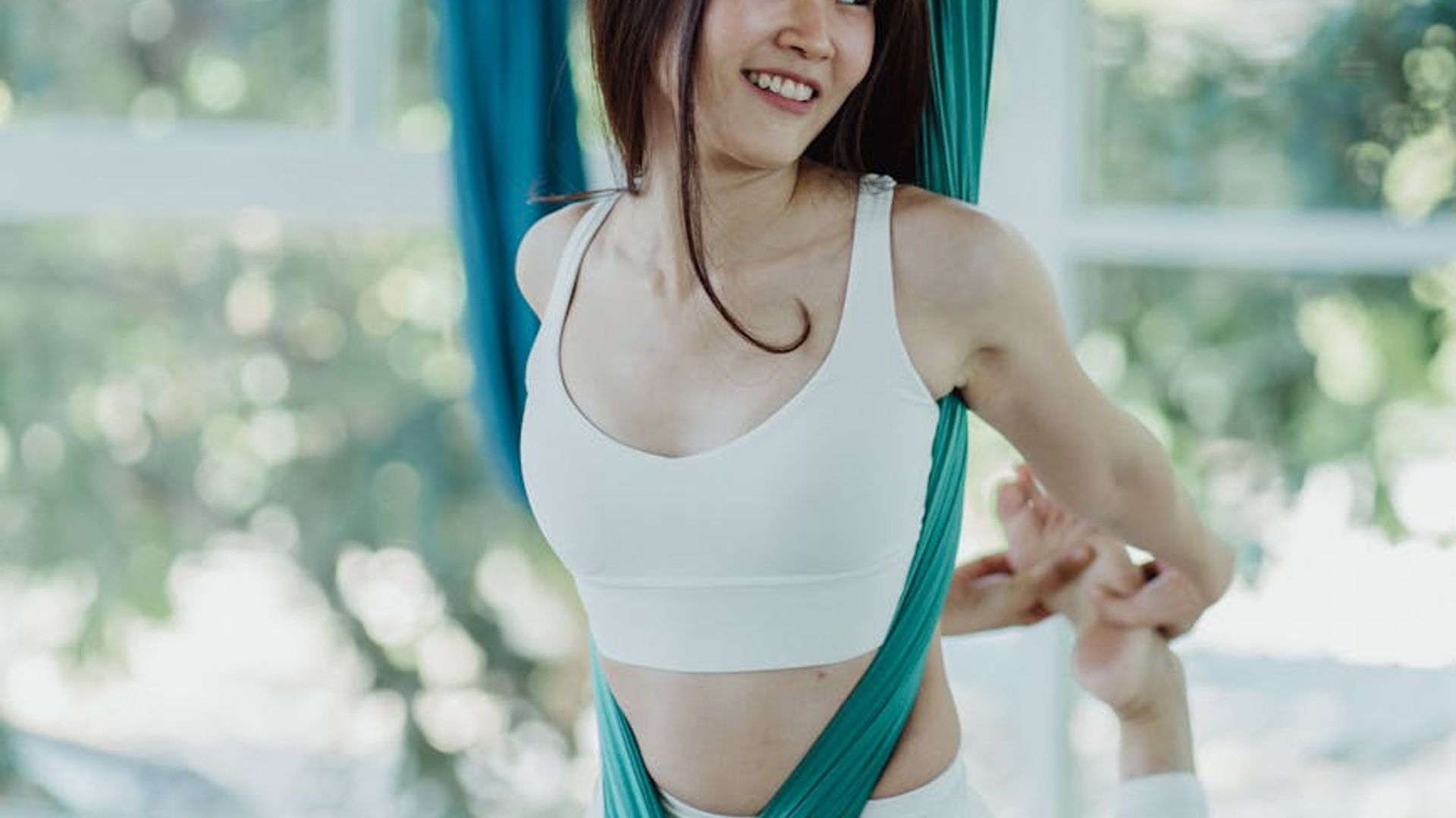 Woman focusing on inner core strength in dark studio